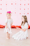 Rosebud Bows Smocked Ruffle Dress