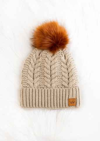CABLE KNIT RUST FAUX POM BEANIE