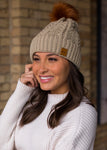 CABLE KNIT RUST FAUX POM BEANIE